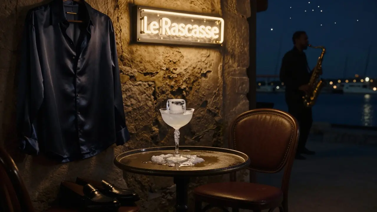 A luxury cocktail at Le Rascasse with silk shirt and hidden neon glow in the old port.
